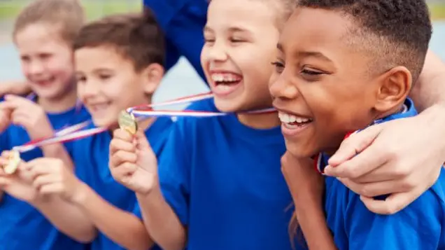 Boys showing their medals