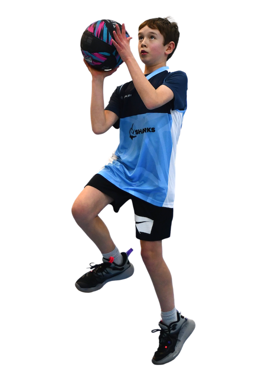 Boy shooting a basketball