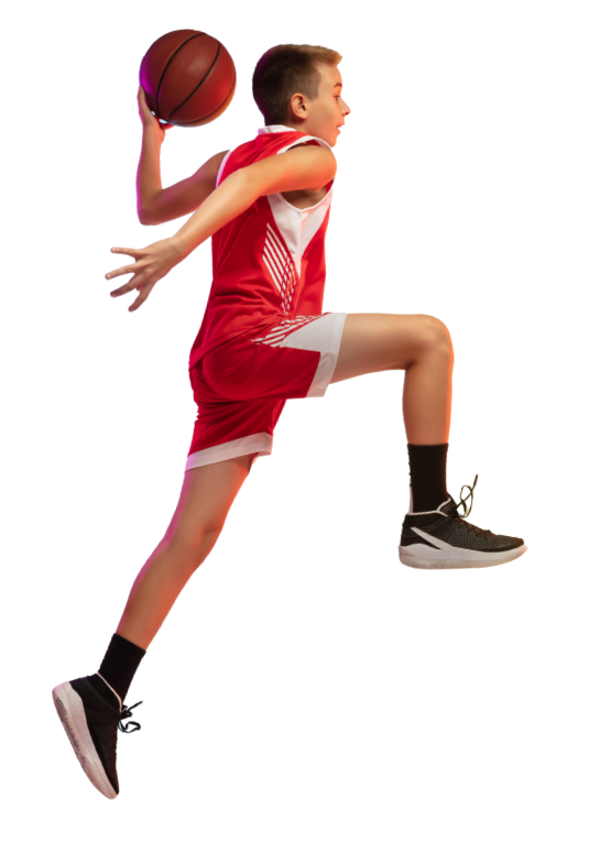 Boy dunking a basketball